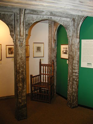 Reproduction chair in an arch