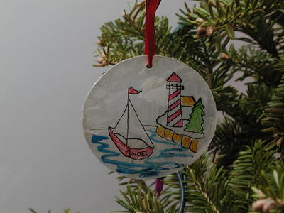 Boat and lighthouse ornament