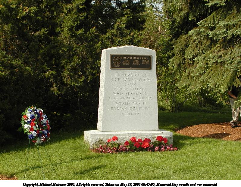 Memorial Day wreath and war memorial