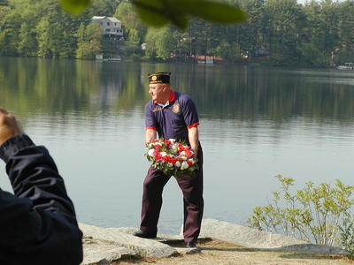 Casting the wreath onto Forge Pond for Memorial Day