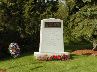 Memorial Day wreath and war memorial
