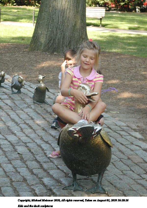 Kids and the duck sculptures #4