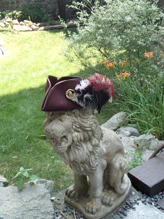 Lion at Hammond Castle with hat