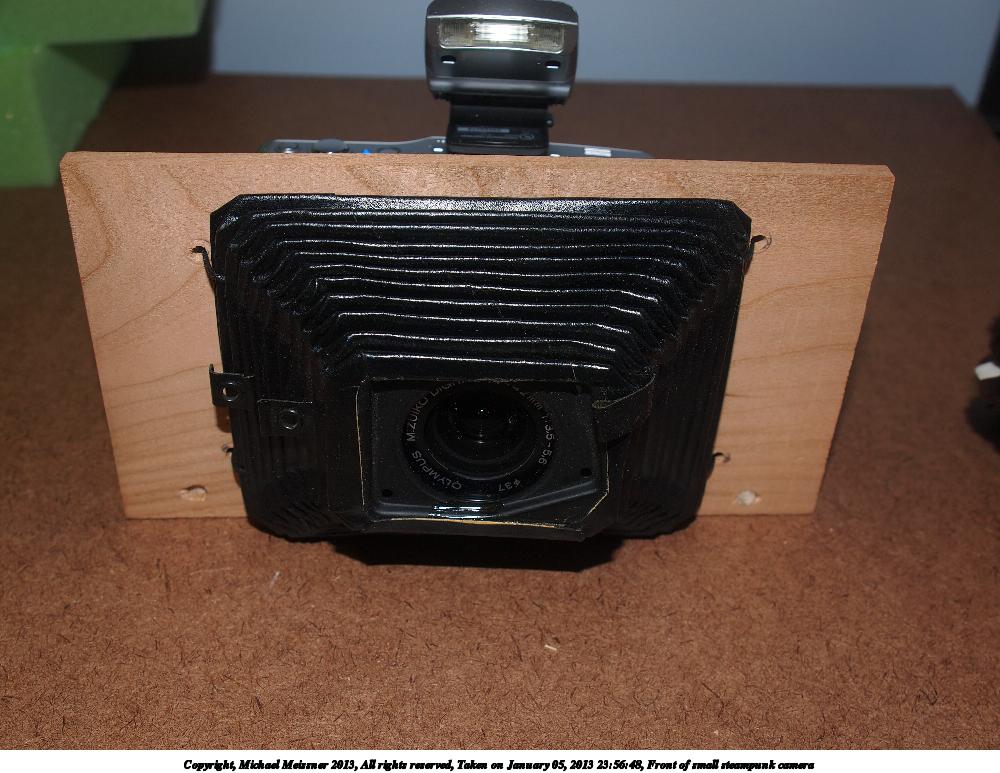 Front of small steampunk camera