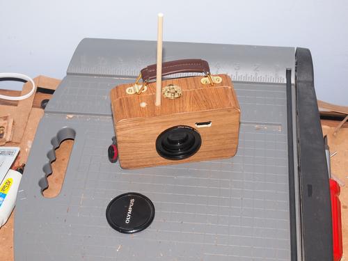 Travel camera with preliminary shutter release