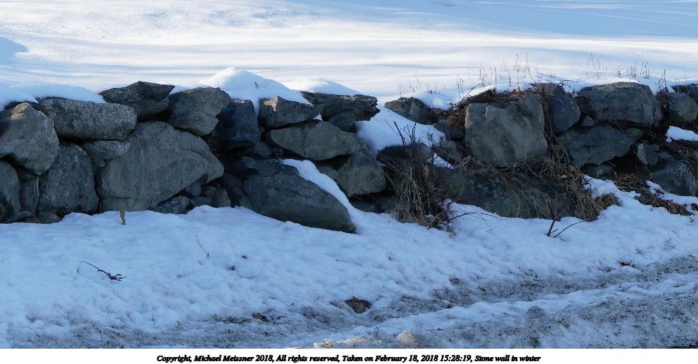 Stone wall in winter