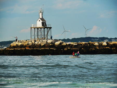 Ten Pound Island Lighthouse and fisherfolk