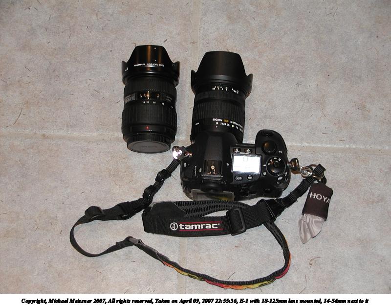 E-1 with 18-125mm lens mounted, 14-54mm next to it