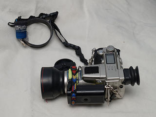 C-2100UZ with DPS-9000 battery, eyecup, wrist strap, and Hoya multi-angle lens hood