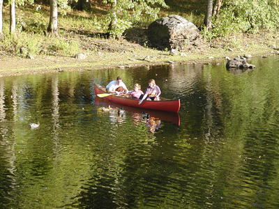 Canoe and ducks at the north bridge