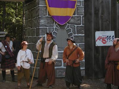Little John, Friar Tuck, and Alan a Dale at the front gate