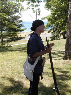 Tour guide representing an Iroquois warrier
