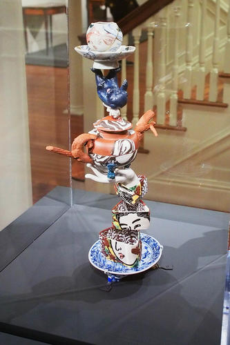 Teapot in hand sculpture
