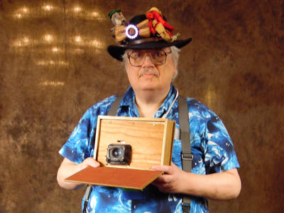 Arisia photo booth picture of me with my book camera #2