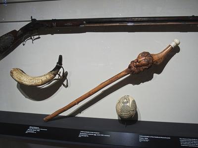 Rifle, powder horn, cane, and scrimshaw egg